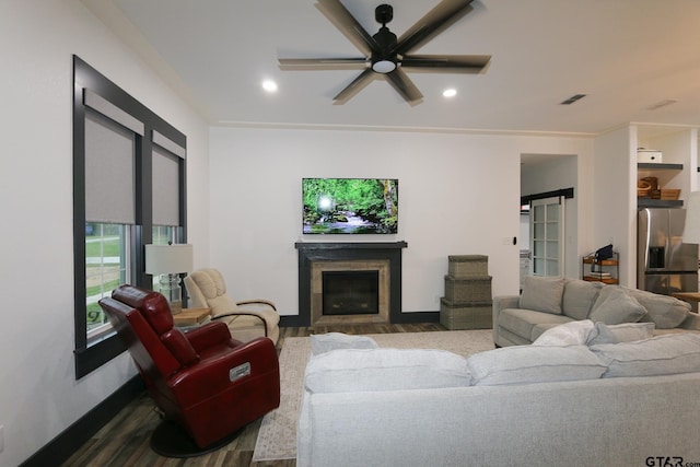 living room with recessed lighting, wood finished floors, ceiling fan, and a glass covered fireplace