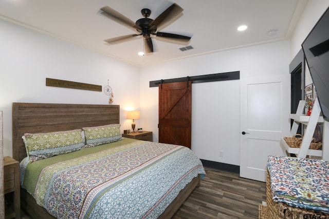 bedroom featuring visible vents, ceiling fan, wood finished floors, recessed lighting, and a barn door
