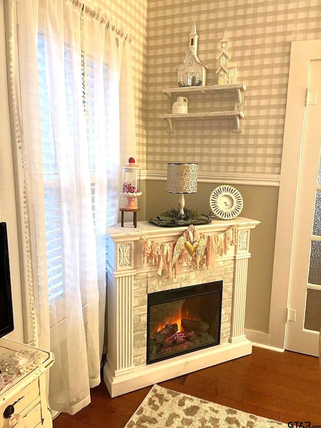 interior details with a fireplace and hardwood / wood-style flooring