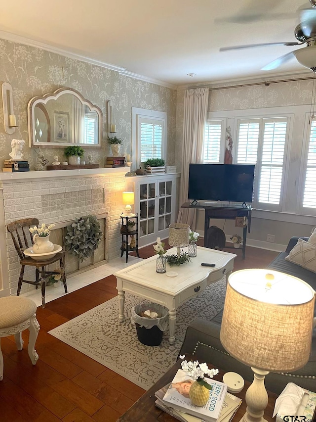 living area featuring ceiling fan, crown molding, and wood-type flooring