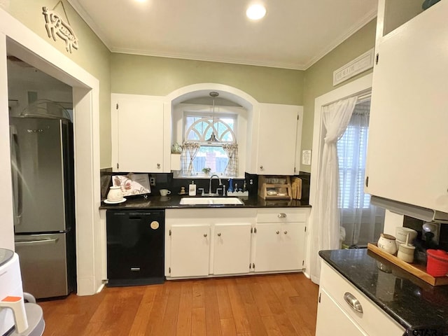 kitchen with dishwasher, white cabinetry, decorative backsplash, sink, and stainless steel fridge