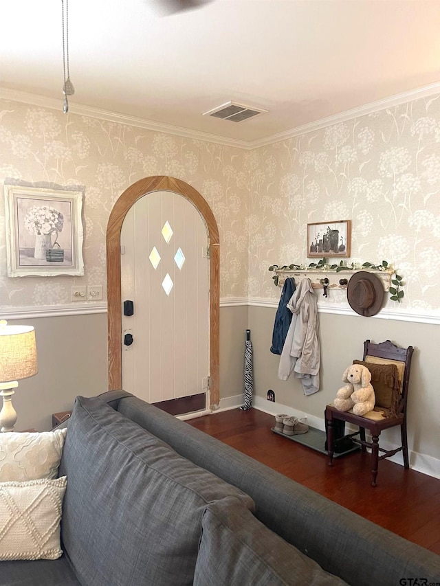 interior space featuring dark wood-type flooring and ornamental molding