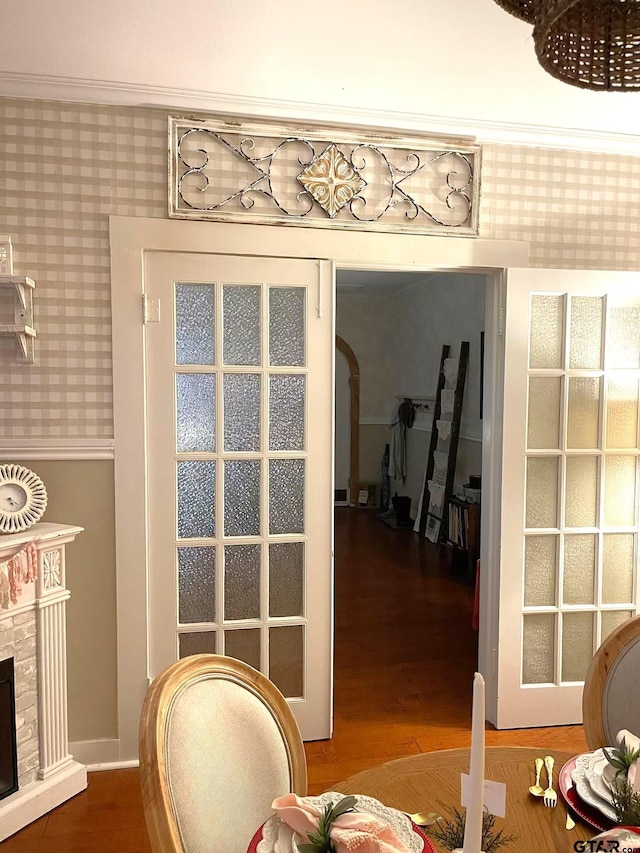 interior space featuring ornamental molding and hardwood / wood-style flooring