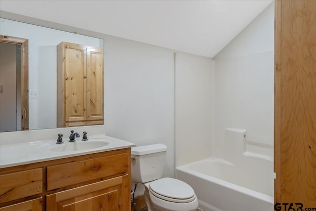 full bathroom with toilet, vanity, lofted ceiling, and shower / bathtub combination