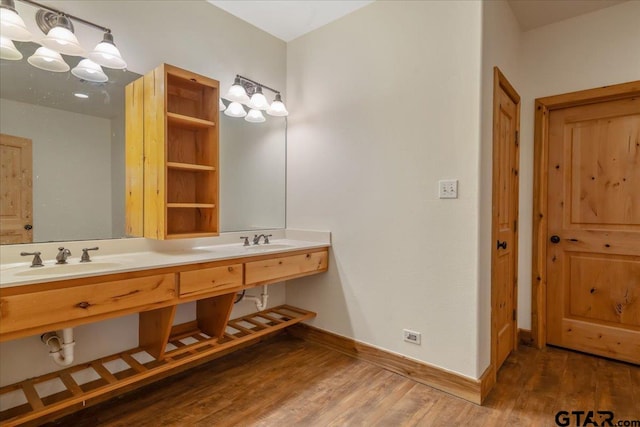 bathroom with hardwood / wood-style floors and vanity