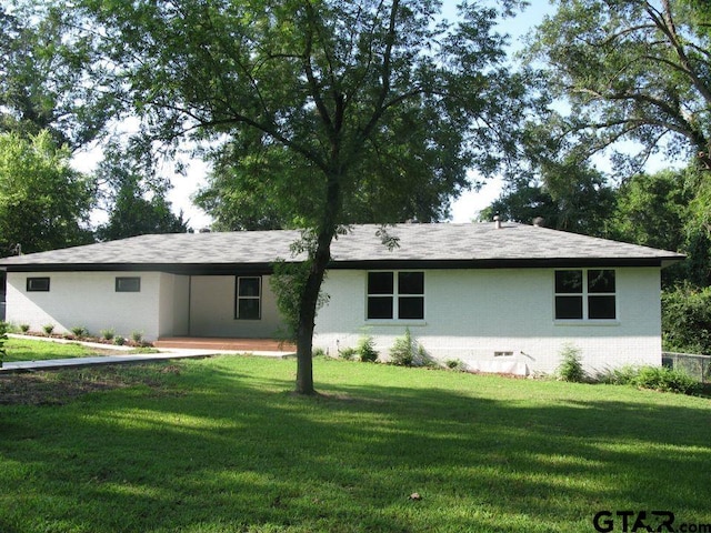 ranch-style house featuring a patio and a front yard