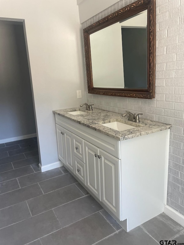 bathroom with vanity and tile patterned floors