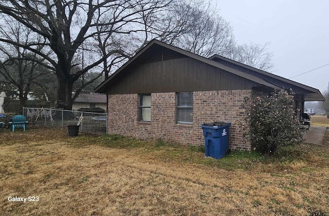 view of side of property with a yard