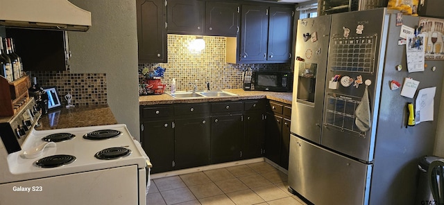 kitchen featuring sink, stainless steel fridge, backsplash, white electric range oven, and exhaust hood