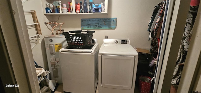 laundry area with separate washer and dryer and water heater