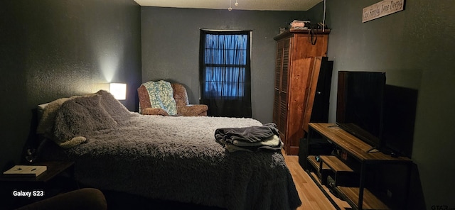 bedroom featuring hardwood / wood-style flooring