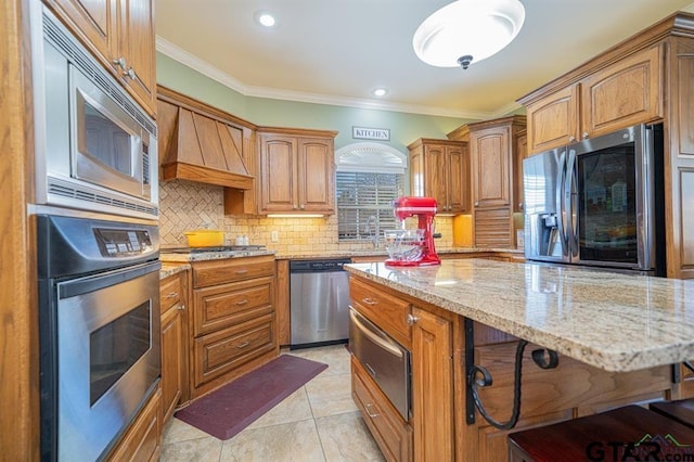 kitchen with a warming drawer, light stone countertops, crown molding, decorative backsplash, and appliances with stainless steel finishes