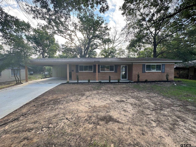 625 Northcrest Dr, Tyler, TX 75702 - single story home with brick siding, concrete driveway, and an attached carport