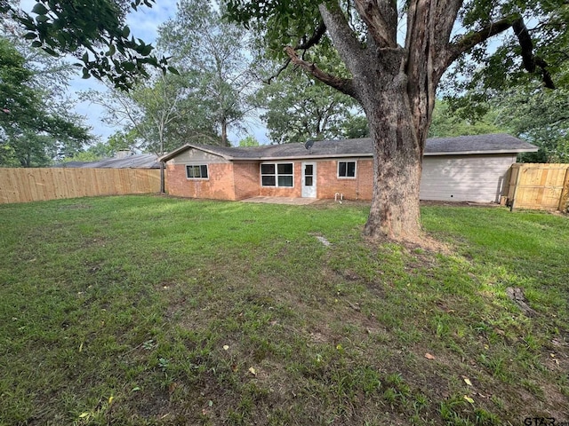 625 Northcrest Dr, Tyler, TX 75702 - back of property with brick siding and a fenced backyard