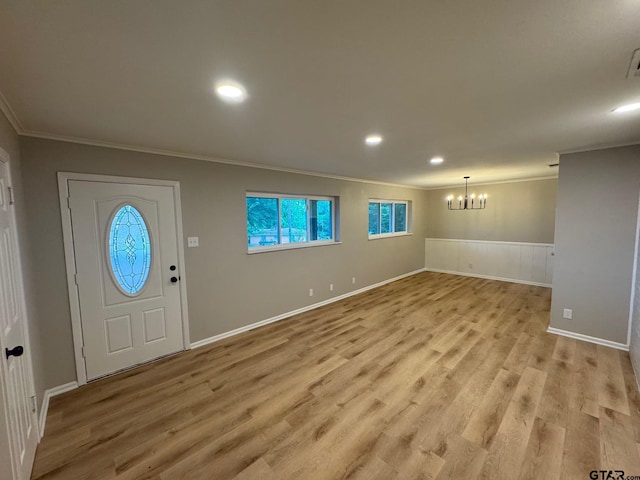 625 Northcrest Dr, Tyler, TX 75702 - foyer featuring ornamental molding, a chandelier, light wood-style floors, wainscoting, and recessed lighting