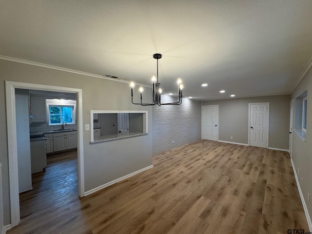 625 Northcrest Dr, Tyler, TX 75702 - unfurnished dining area with a chandelier, wood finished floors, crown molding, and recessed lighting