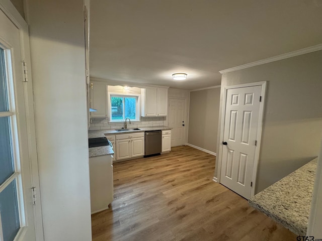 625 Northcrest Dr, Tyler, TX 75702 - kitchen featuring dishwasher, crown molding, decorative backsplash, white cabinets, and light wood finished floors