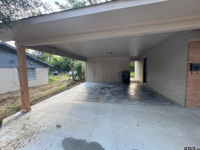 625 Northcrest Dr, Tyler, TX 75702 - view of parking featuring a carport and concrete driveway