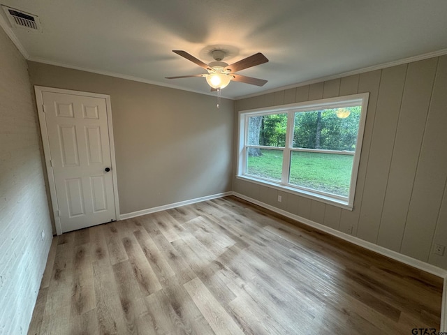 625 Northcrest Dr, Tyler, TX 75702 - empty room with light wood finished floors, a ceiling fan, and ornamental molding