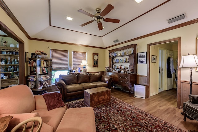 3805 Allendale Dr, Tyler, TX 75701 - living area featuring a ceiling fan, a raised ceiling, wood finished floors, and wainscoting