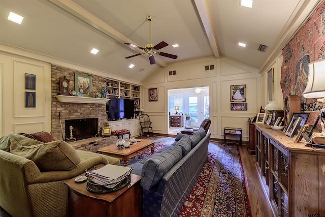 3805 Allendale Dr, Tyler, TX 75701 - living area with dark wood-type flooring, a ceiling fan, a fireplace, a decorative wall, and built in features