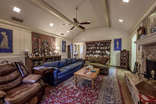 3805 Allendale Dr, Tyler, TX 75701 - living room with a decorative wall, wood finished floors, ceiling fan, and a brick fireplace
