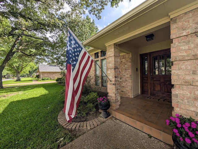 3805 Allendale Dr, Tyler, TX 75701 - property entrance with a lawn and brick siding