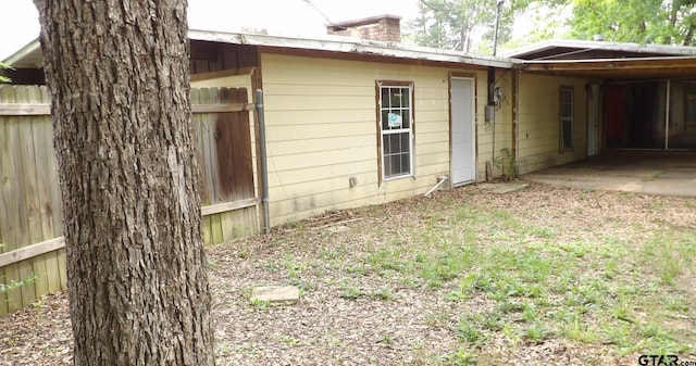 915 John St, Jacksonville, TX 75766 - view of property exterior featuring fence and a chimney