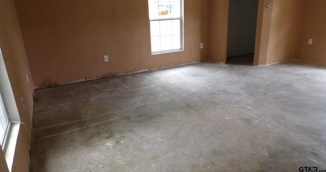 915 John St, Jacksonville, TX 75766 - unfurnished room with concrete floors