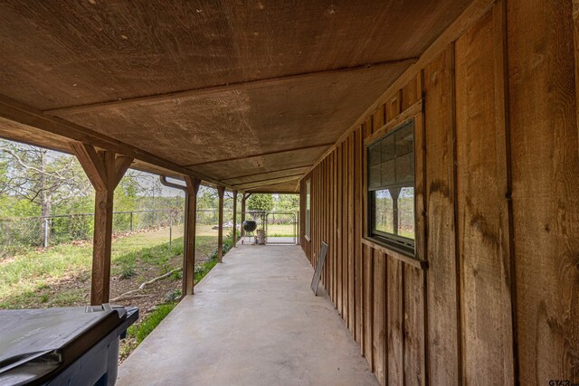 view of patio with a gate and fence