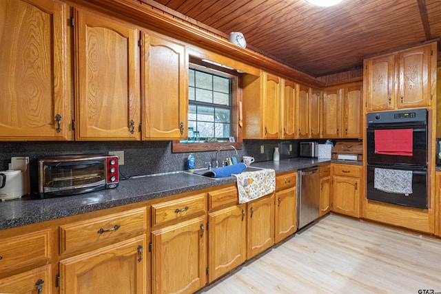 kitchen with dobule oven black, brown cabinetry, stainless steel dishwasher, and a toaster