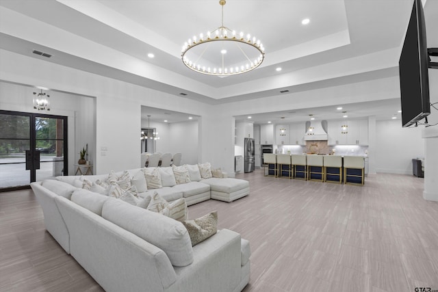 living room with a tray ceiling