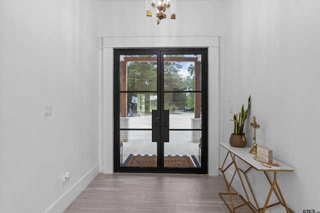 entryway featuring french doors and light hardwood / wood-style floors