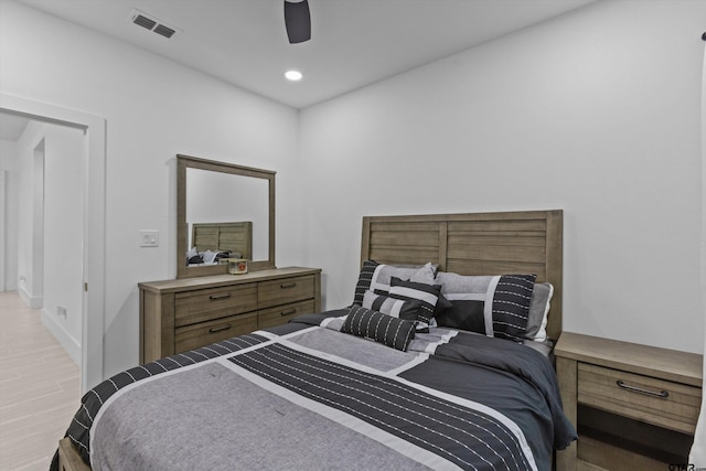 bedroom featuring ceiling fan and light hardwood / wood-style flooring