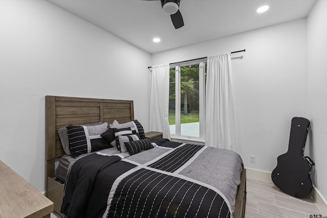 bedroom with light hardwood / wood-style floors and ceiling fan