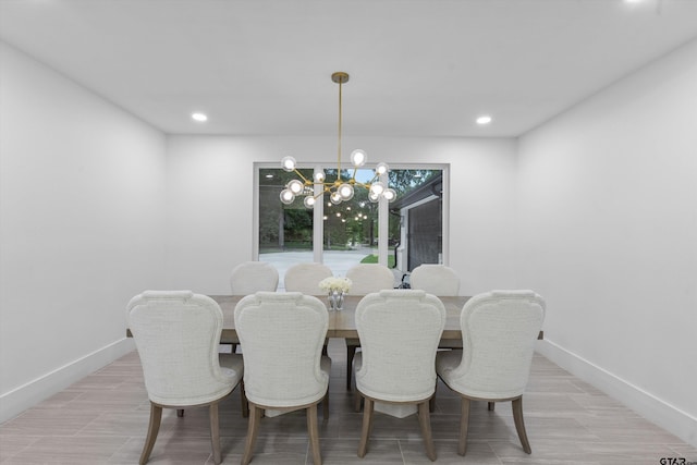 dining space featuring a notable chandelier