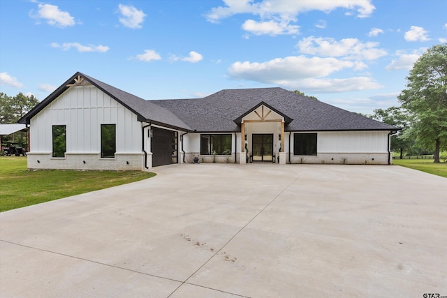 modern farmhouse with a garage and a front yard