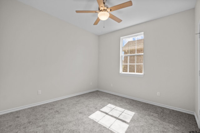 unfurnished room featuring light carpet and ceiling fan