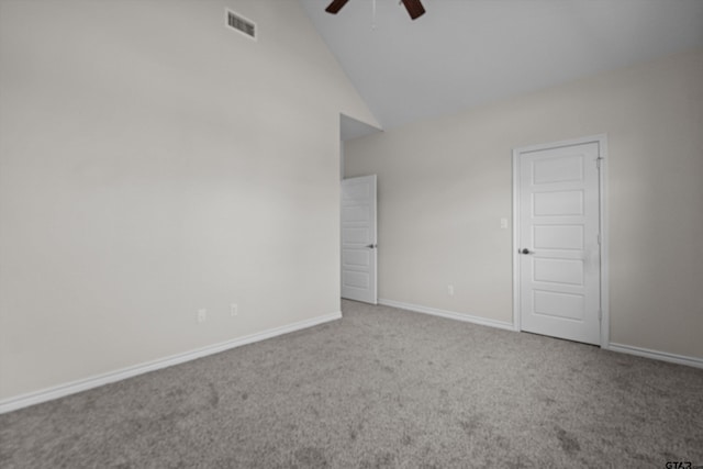 empty room with ceiling fan, high vaulted ceiling, and carpet floors