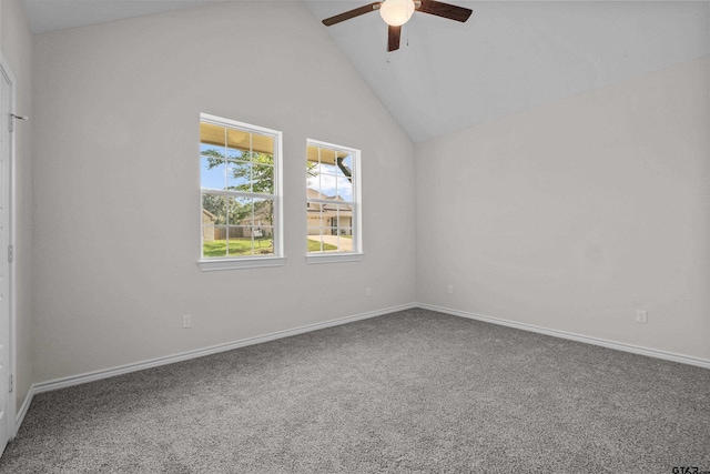 carpeted empty room featuring ceiling fan and high vaulted ceiling