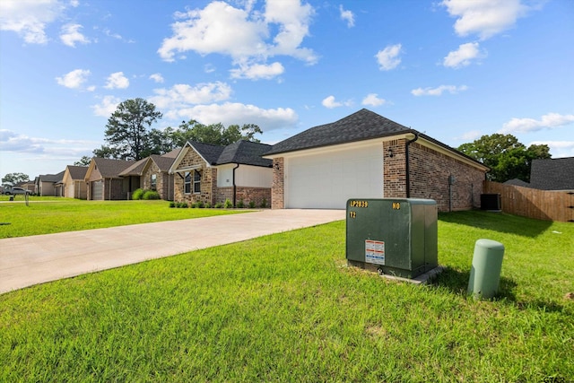 ranch-style home featuring a garage, cooling unit, and a front yard