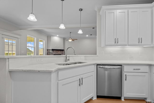 kitchen with dishwasher, sink, and white cabinets