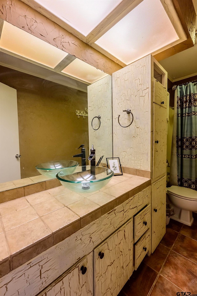 bathroom featuring toilet and vanity