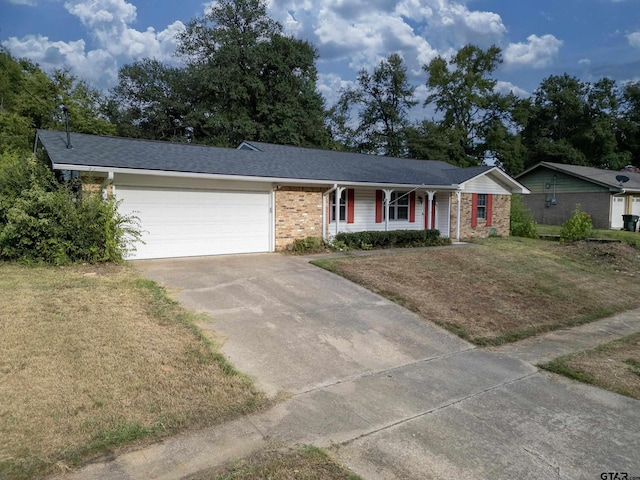 single story home with a garage, a front lawn, and a porch