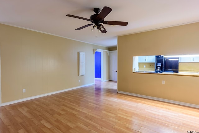 unfurnished room featuring light wood-type flooring, ceiling fan, and crown molding