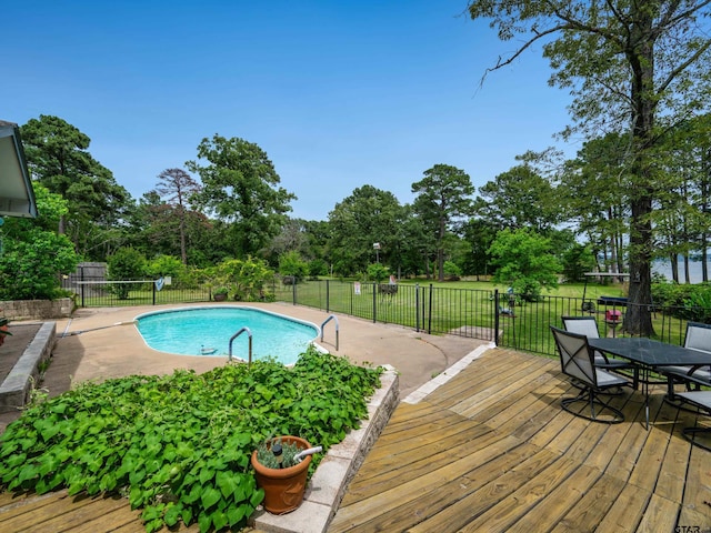 1915 Big Eddy Cir, Chandler, TX 75758 - view of swimming pool featuring fence, a deck, and view of wooded area