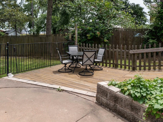 1915 Big Eddy Cir, Chandler, TX 75758 - deck with outdoor dining area and fence