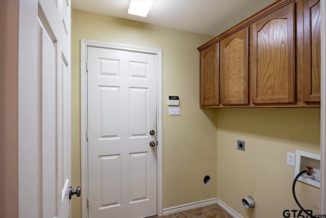 laundry room with washer hookup, cabinets, light tile patterned floors, and hookup for an electric dryer