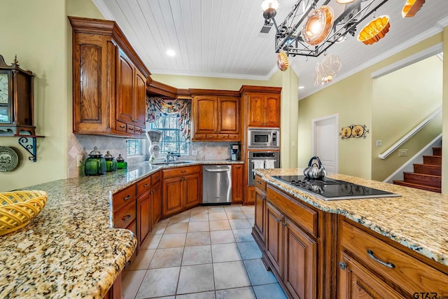 kitchen featuring pendant lighting, backsplash, crown molding, and stainless steel appliances