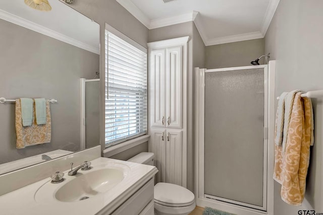 bathroom with toilet, a shower with door, and ornamental molding